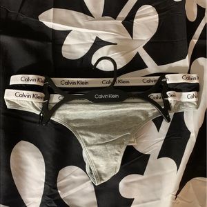Two size large Calvin Klein logo thongs brand new!!